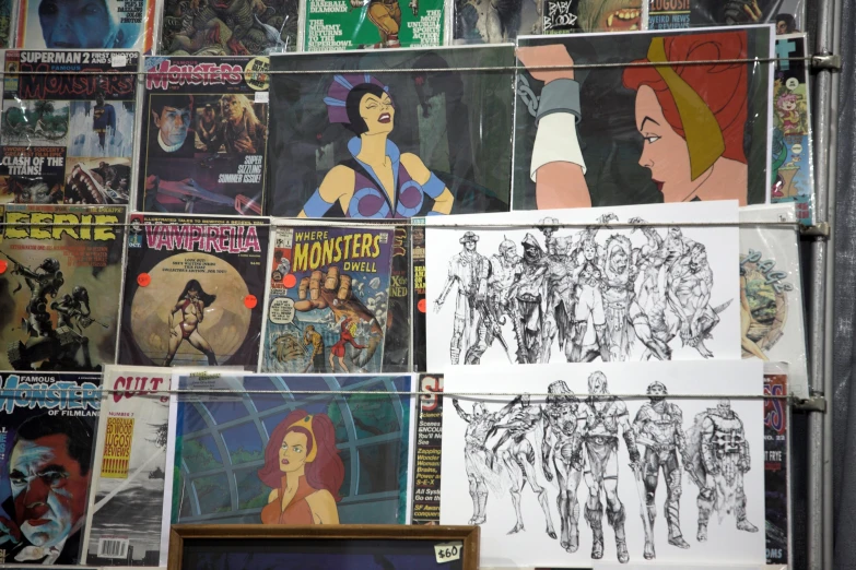 posters of cartoon characters are being displayed on the wall