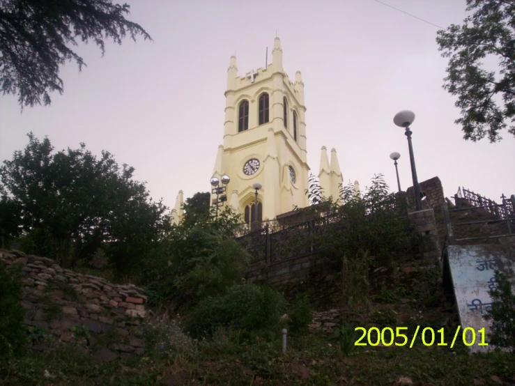 a tall church tower with lots of windows and a clock on the outside