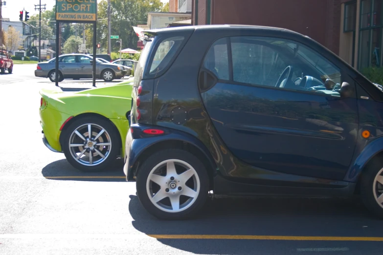 small cars parked near each other on a street