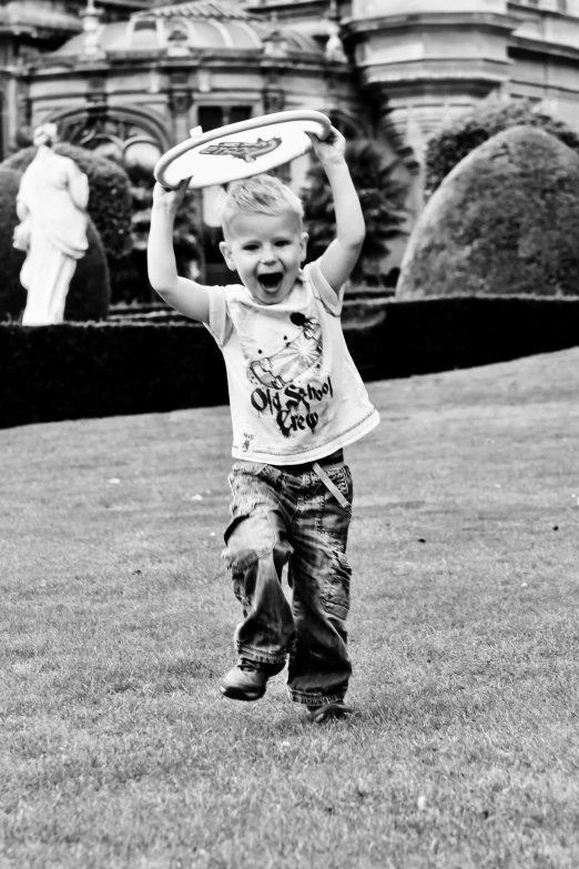 a black and white po of a little boy in a park