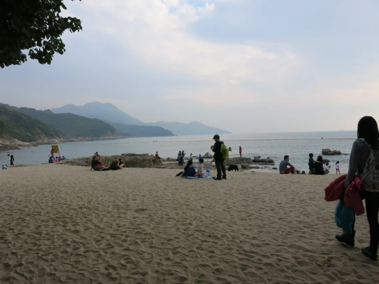 a group of people are on a beach