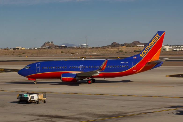 an airplane is sitting on the runway at the airport