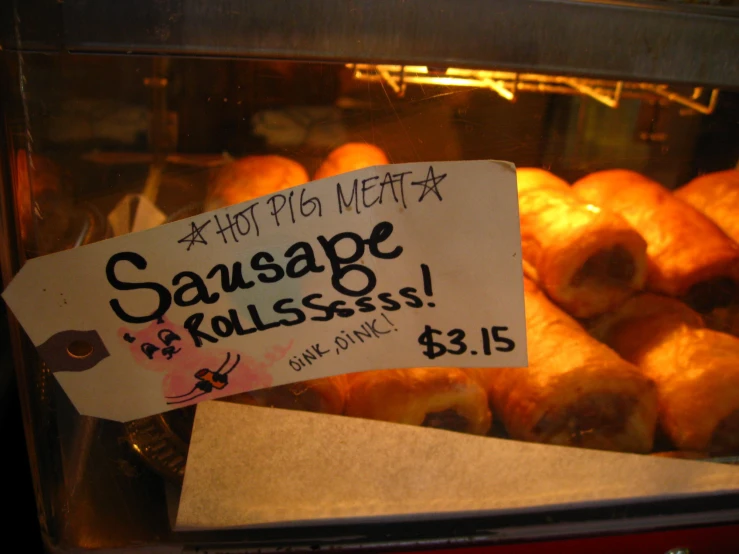 the sign for sausage rolls is clearly on sale
