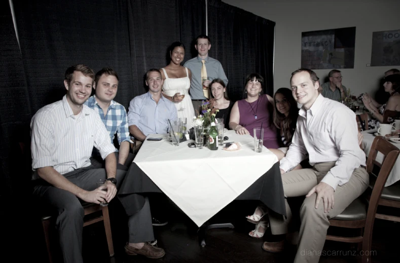 there is a very large group of people sitting at a table