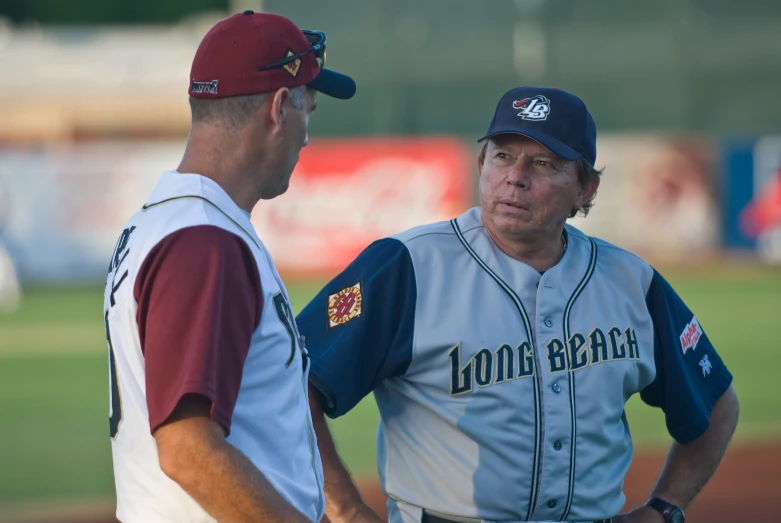 two men standing on the field at a baseball game