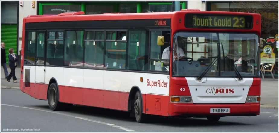 a city bus traveling down a city street