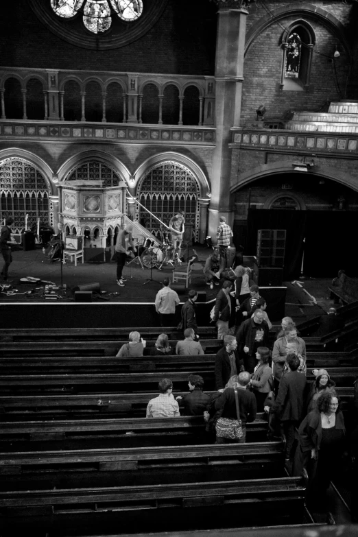 people are in an old church with the clock