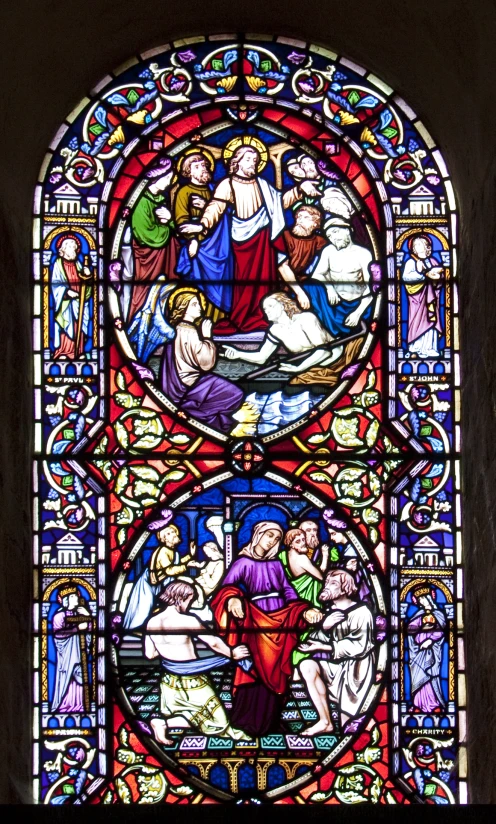 the stained glass has a depiction of jesus on it