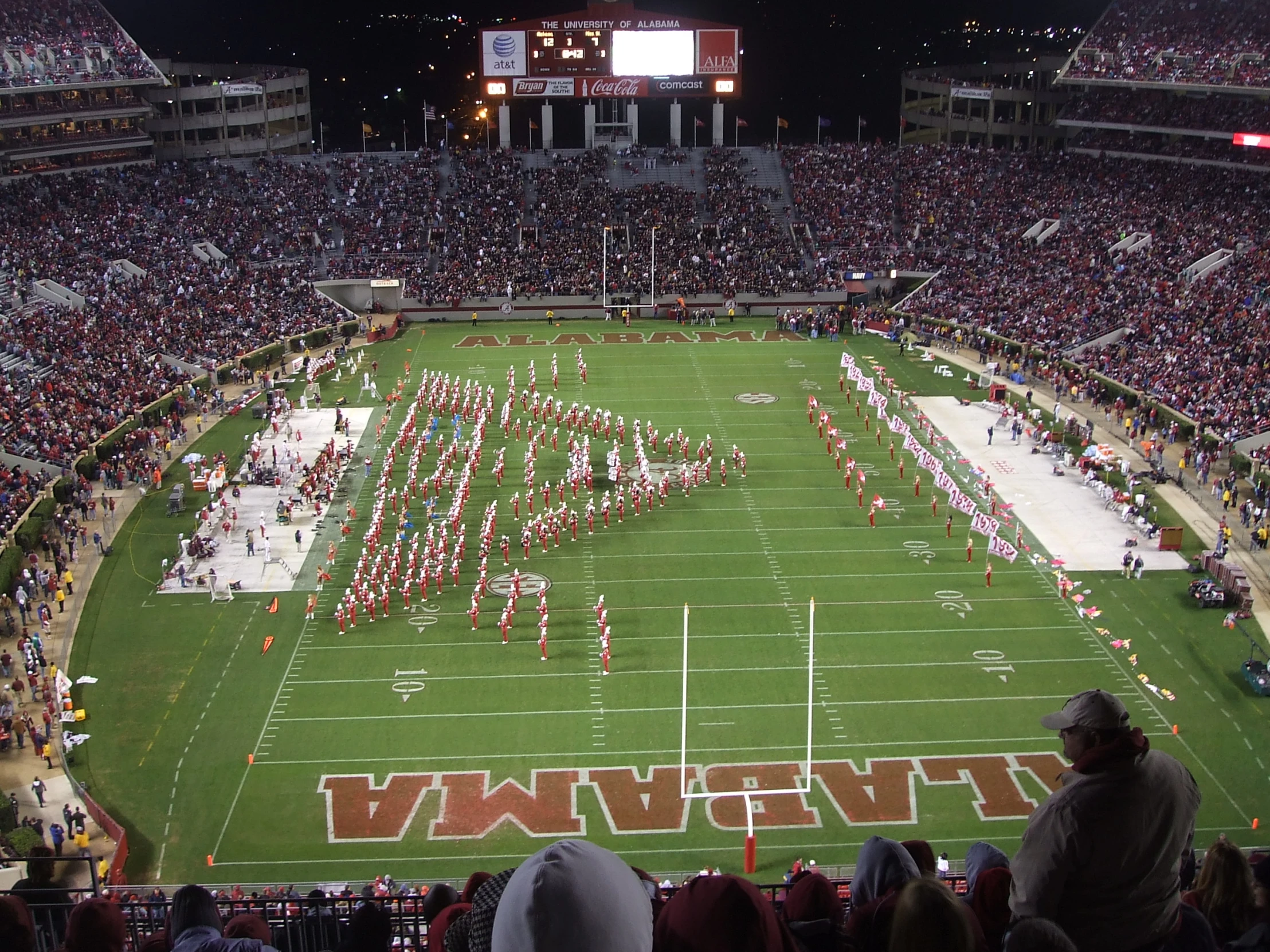 a football stadium full of people wearing cheerleader gear