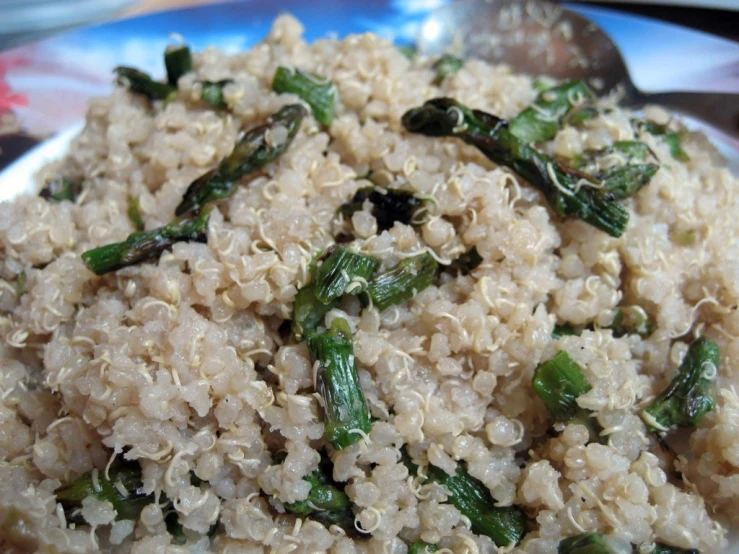 a white plate full of rice and vegetables