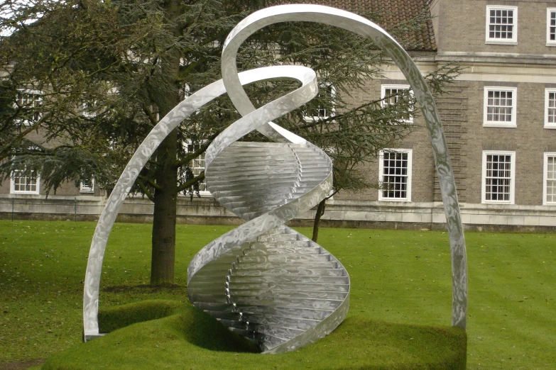 a large metal sculpture sitting in the middle of a park