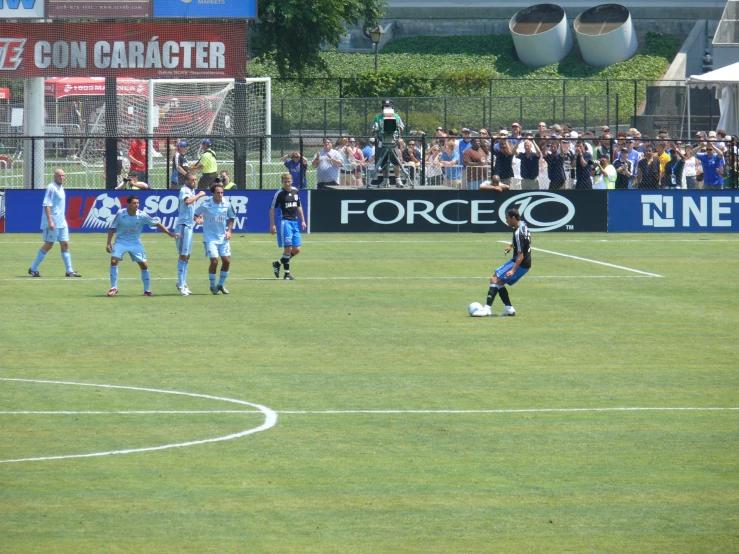 there are some young s playing soccer on the field