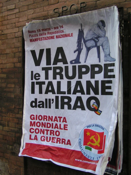 a sign outside a brick building written via tupper it italiane dal'irao