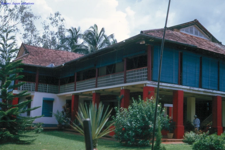 a large house with a tall porch in the back