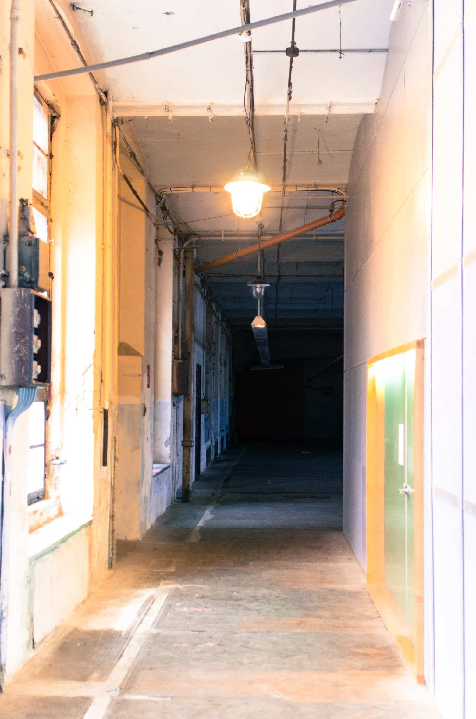 an image of a hallway leading to the rooms