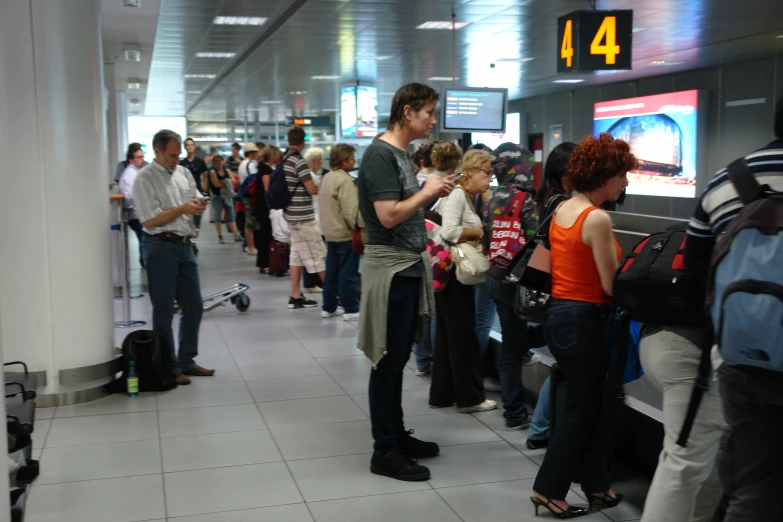 people at the luggage claim at the airport