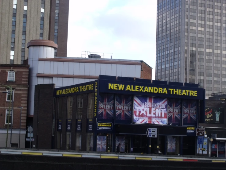 the outside of an old theatre in a big city