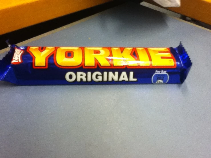 a new yorke bar candy wrapper sitting on top of a table