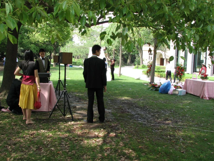 a couple getting married next to a tv camera