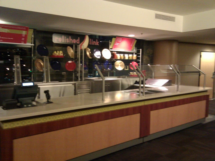 a kitchen is shown with a metal counter