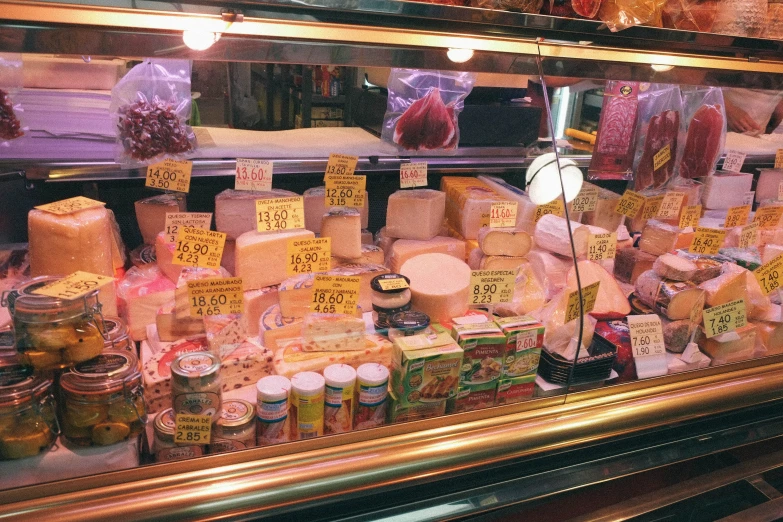 a store front filled with various types of cheese