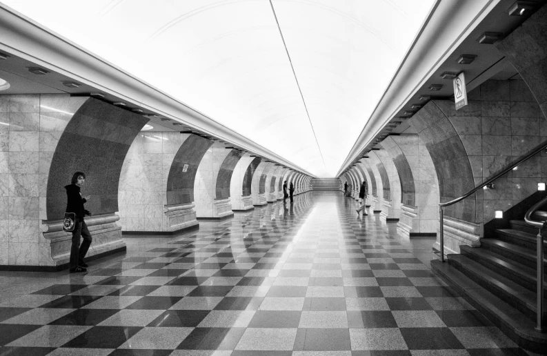 a very long and well lit subway station
