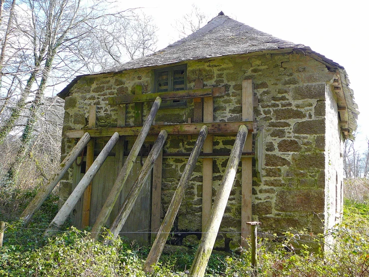 a old building made of stone with various windows