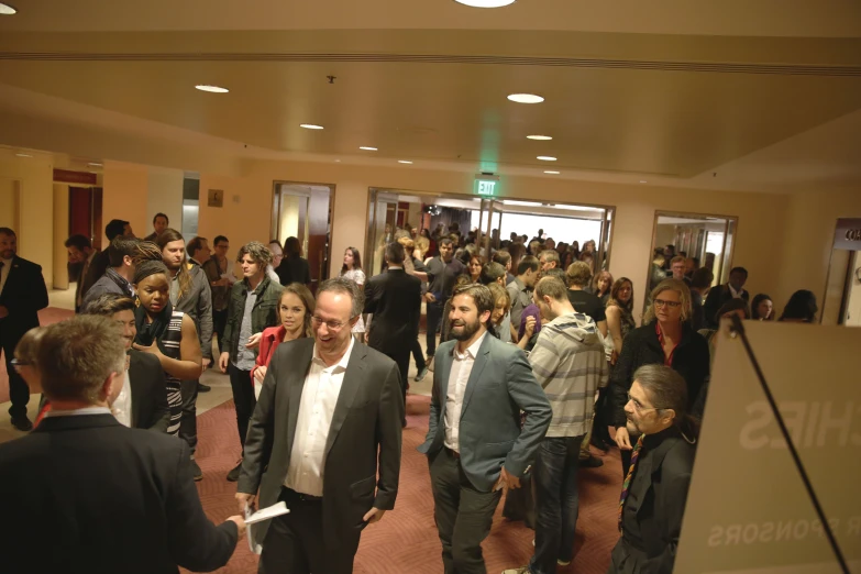 large group of people gathered in a business lobby