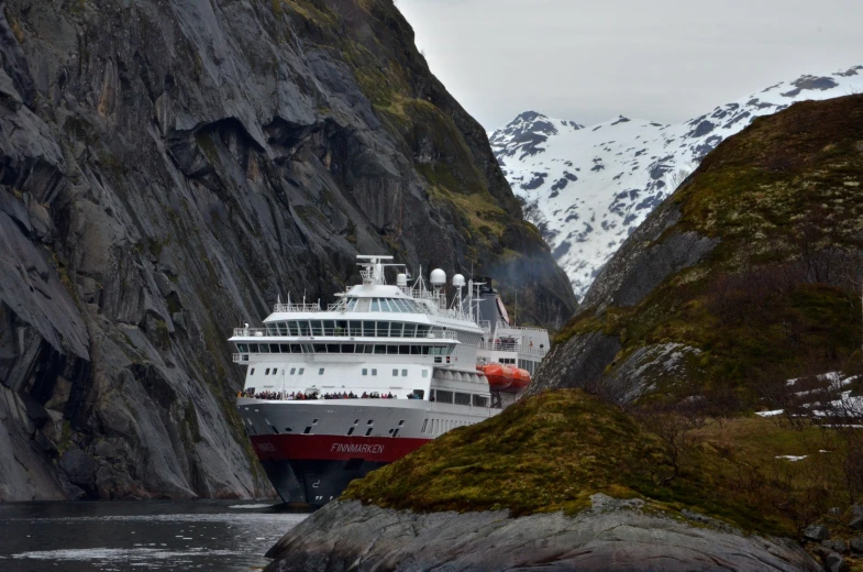 a big boat is going through a canyon