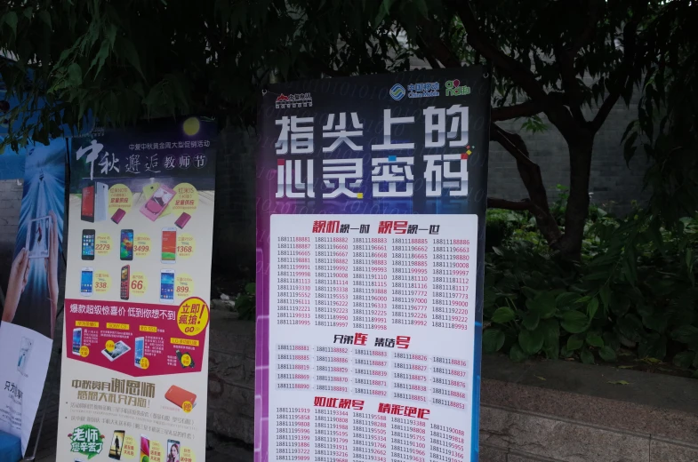 a sign advertising various types of goods at a market