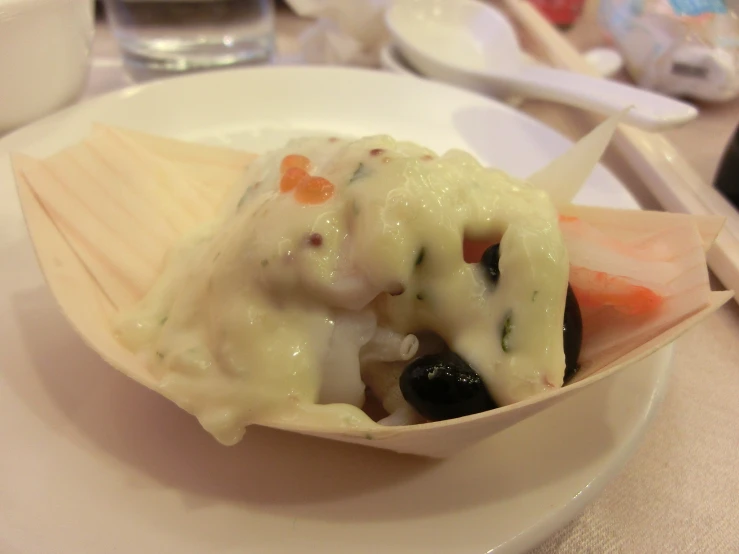 a white plate topped with a vegetable filled lasagna