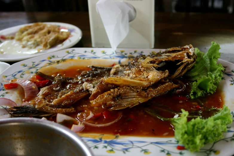 a plate of cooked food is sitting on a table