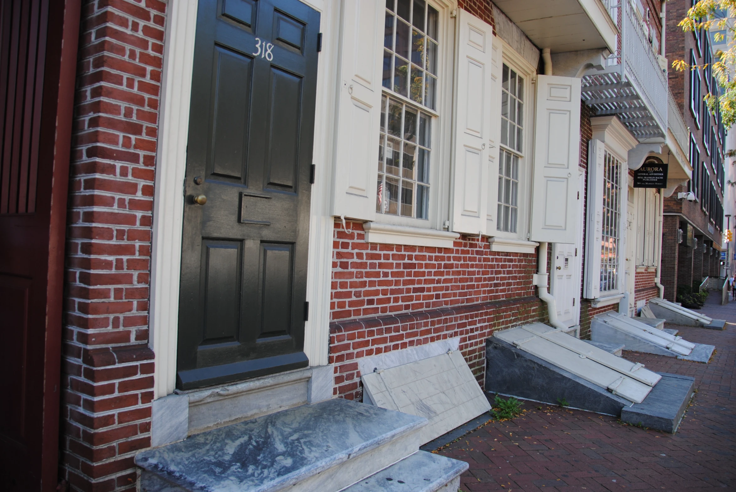 several empty concrete steps by a building on a city street