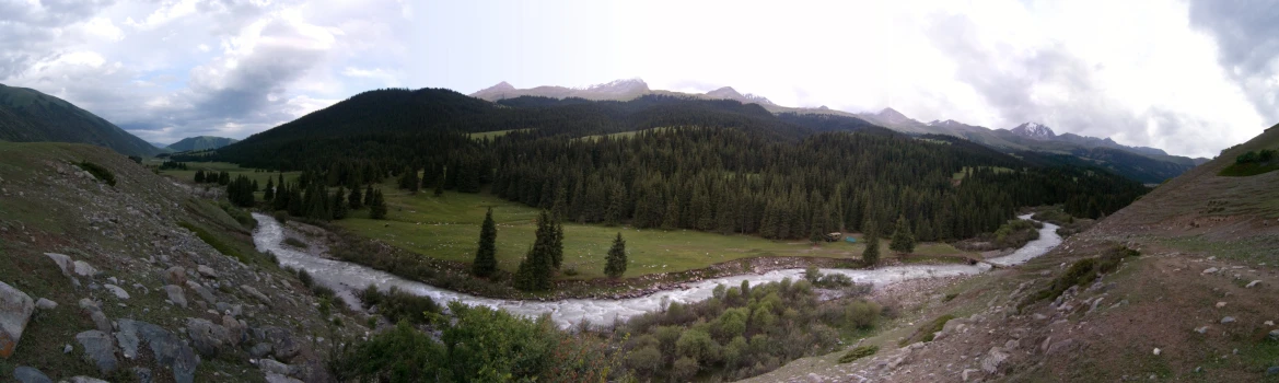 two rivers meander through the mountains surrounded by greenery