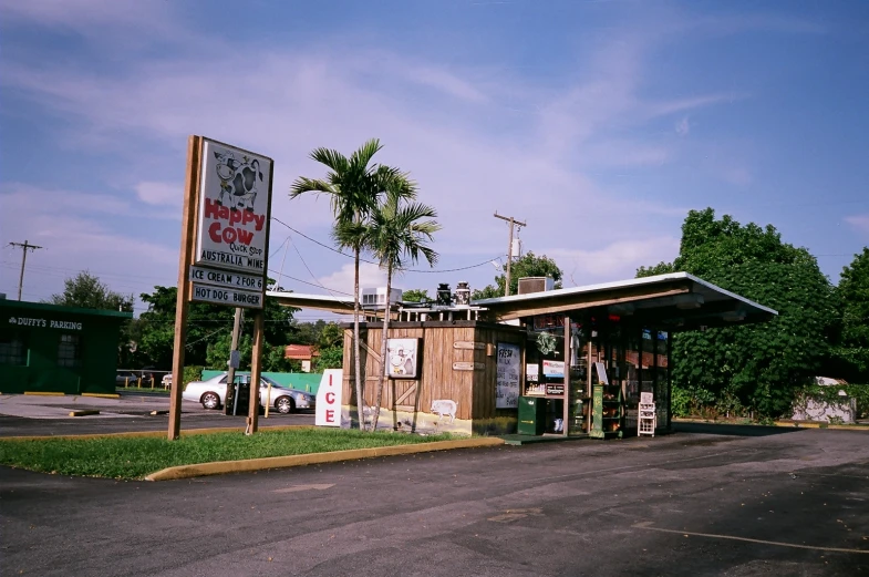 a small shop next to an empty street