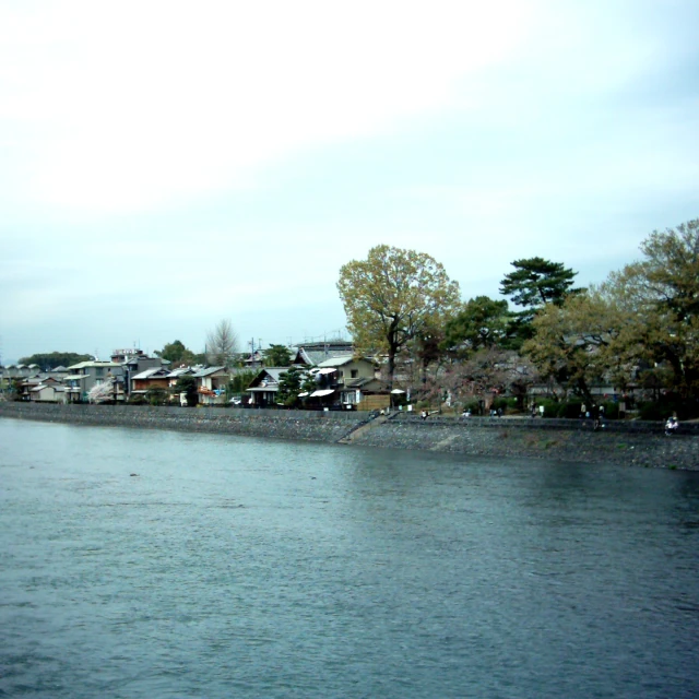 a row of houses sitting on a large lake