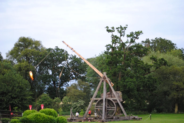 there is a structure in the foreground near a park