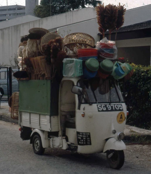 a delivery truck with many items on the back