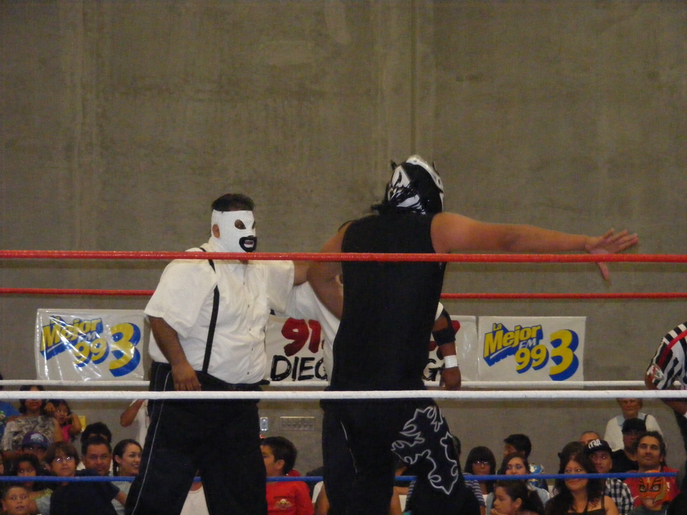 two wrestlers on the ring at a competition