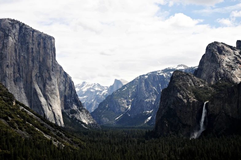 this is an image of a mountain landscape with waterfall