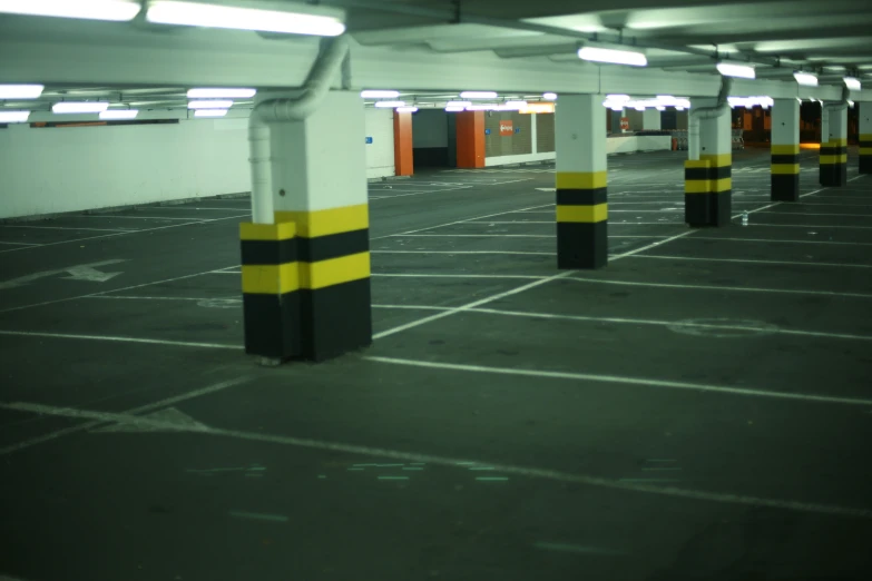 a empty parking lot with painted yellow and black stripes