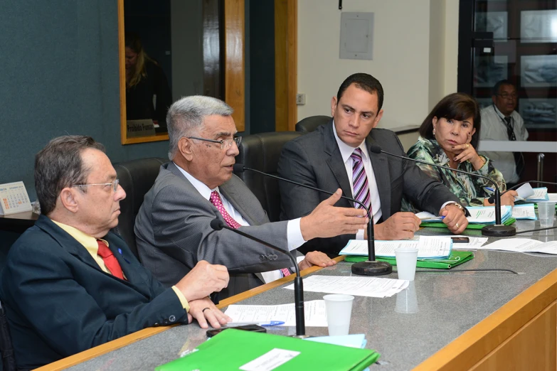 people at table having conversation in meeting room