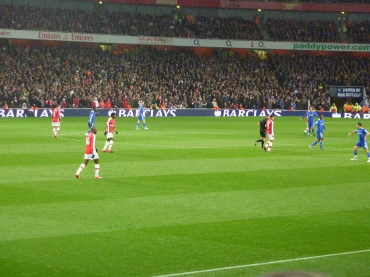 a soccer field with many players on it