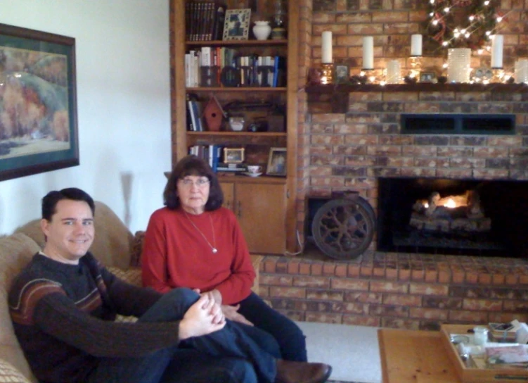 a man and a woman sitting in a living room