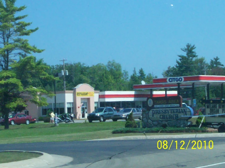 the city bus is parked next to a grocery store