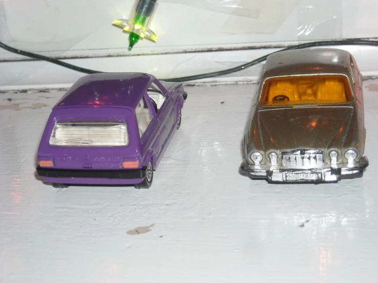 toy cars are shown next to each other