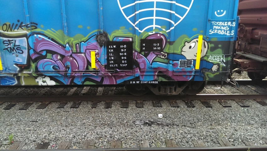 a train car has colorful graffiti on it