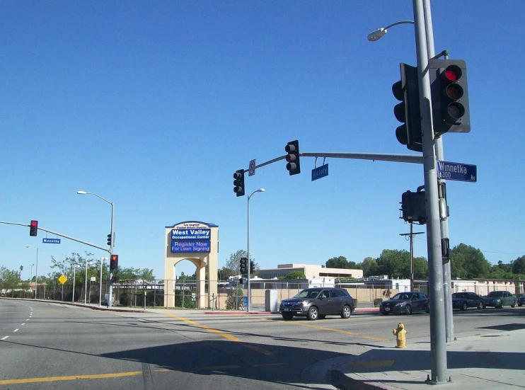 a stop light on the corner of a parking lot