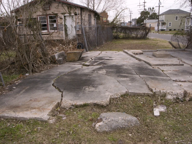 a house is shown behind an empty road