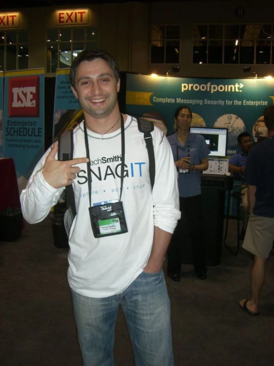 man holding a cell phone wearing a neck belt